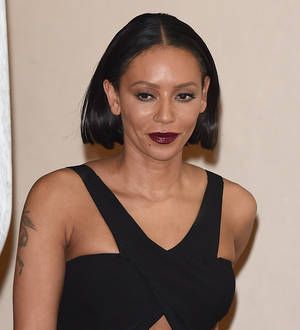 Melanie Brown delays eye surgery
