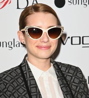 Emma Roberts doused in champagne at event