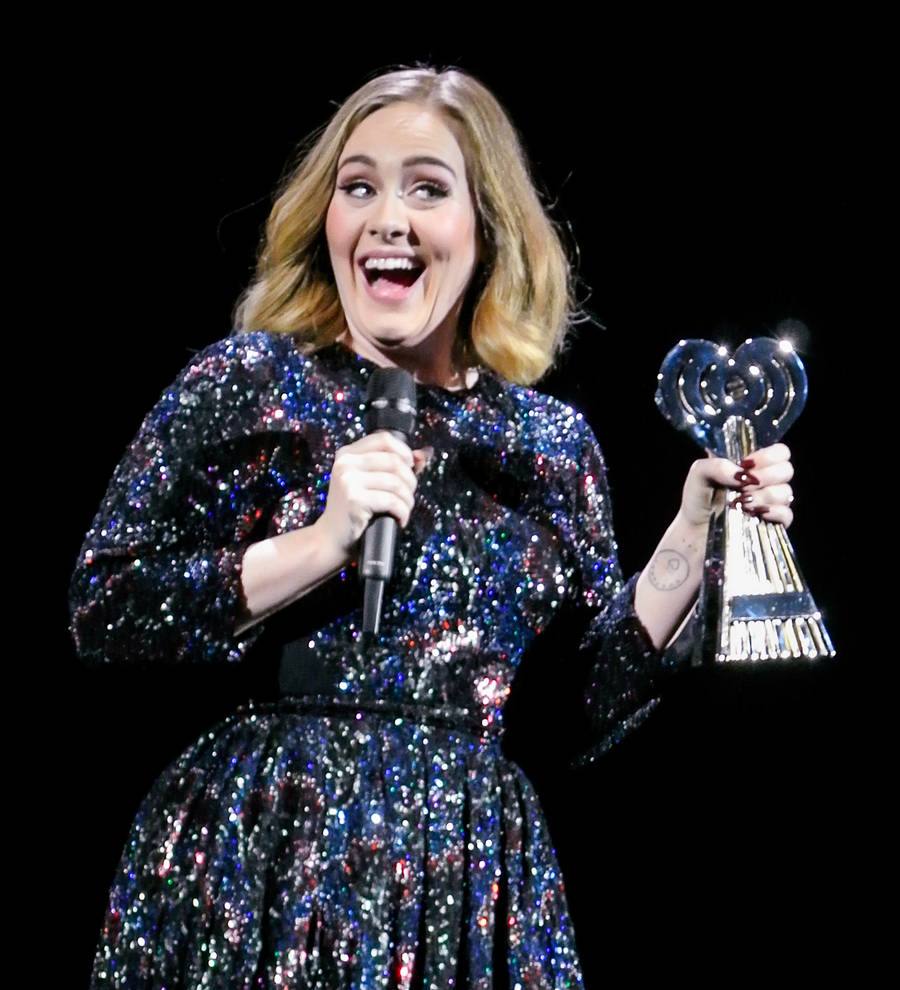 Adele presented with iHeartRadio award mid-concert