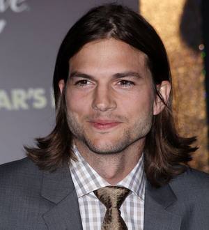 Ashton Kutcher 'just friends' with holiday companion
