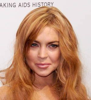 Lindsay Lohan splattered with gold dust outside courthouse