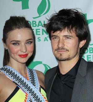 Orlando Bloom and Miranda Kerr promote rival airlines