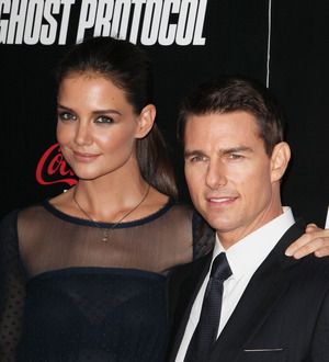 Tom Cruise settles divorce