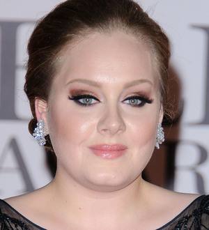 Adele shows off post-surgery voice on TV