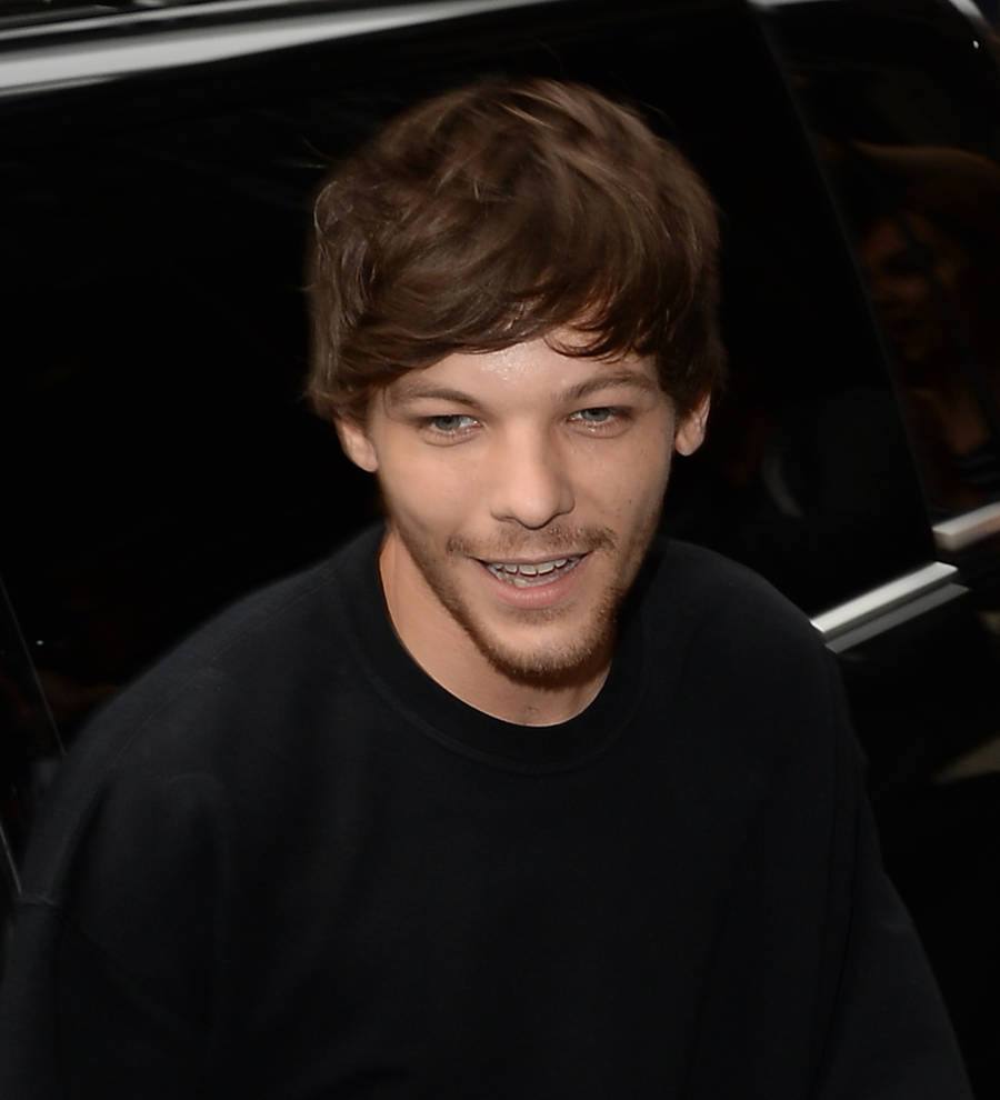 Louis Tomlinson glad to be a young dad