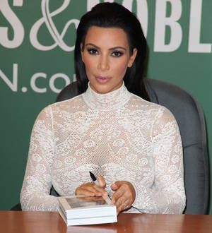 Kim Kardashian confronted by anti-fur campaigners at book signing