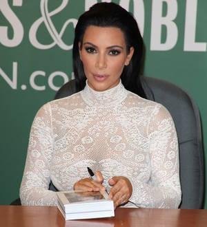 Kim Kardashian confronted by anti-fur campaigners at book signing