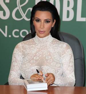 Kim Kardashian confronted by anti-fur campaigners at book signing