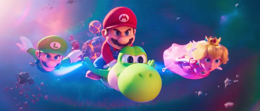 [A blurred screenshot from the Super Mario Galaxy movie, showing planets and stars in a colorful galaxy]