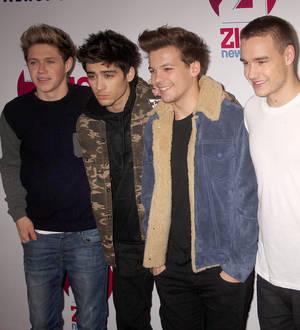 One Direction find fans in trash cans and bushes