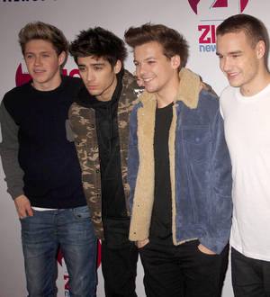 One Direction find fans in trash cans and bushes
