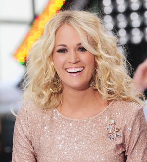 Brad Paisley surprises Carrie Underwood at Nashville concert