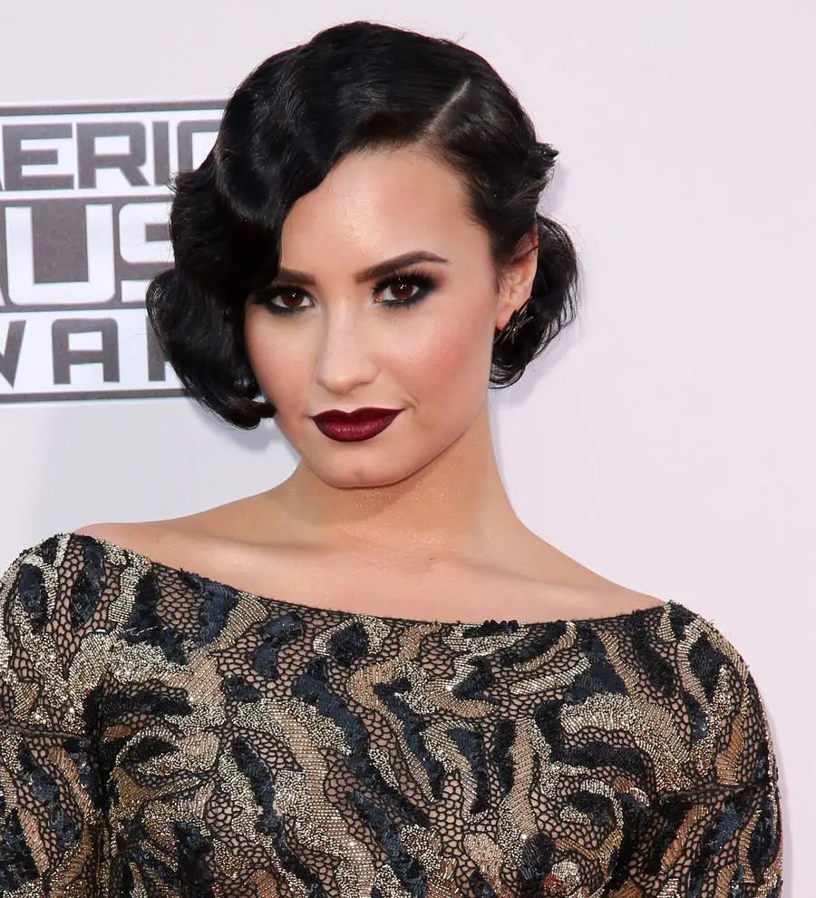 Demi Lovato inspired by Amy Schumer's Pirelli pose