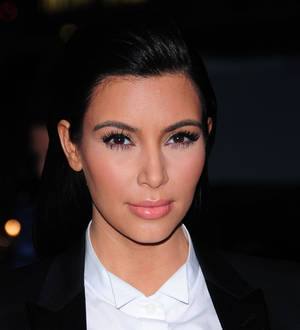 Kim Kardashian attacks prankster over police raid on family home