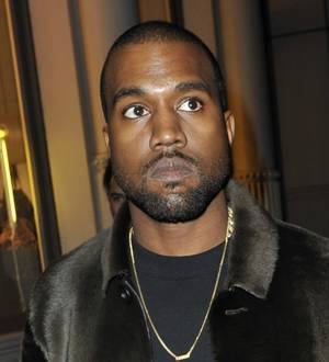 Lenny Kravitz cringes while Kanye West pokes fun at him during gig