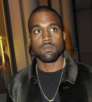 Lenny Kravitz cringes while Kanye West pokes fun at him during gig