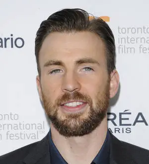 Chris Evans and Minka Kelly walk a dog on a sidewalk during their rekindled romance