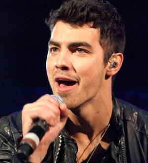 Joe Jonas struck down with mystery stomach pain