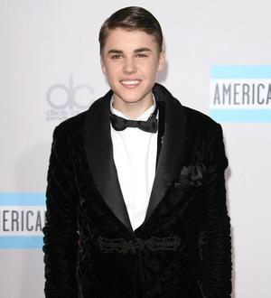 Justin Bieber invests in charity Facebook game
