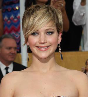 Jennifer Lawrence's messy eating stained American Hustle dresses