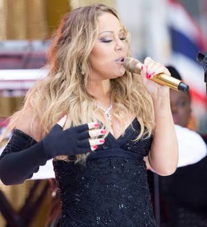 Mariah Carey laughs off lyric mistake during outdoor TV gig