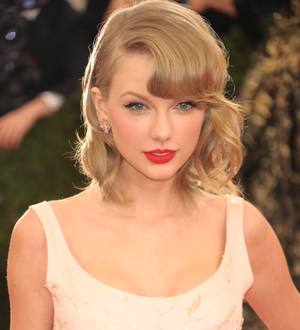Three charged for hurling bottles at Taylor Swift's home
