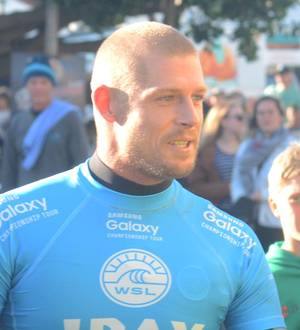 Surfer Mick Fanning attacked by shark on live TV