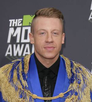 Macklemore makes emotional visit to ailing fan in hospital