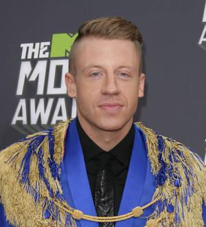 Macklemore makes emotional visit to ailing fan in hospital