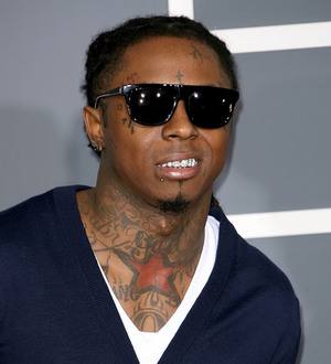 Lil Wayne settles tax debt