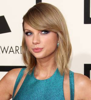 Taylor Swift brings John Legend, Beck and St. Vincent onstage