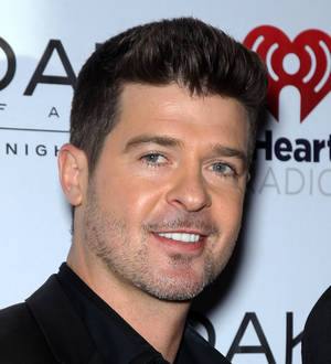 Robin Thicke suffers wardrobe malfunctions on stage