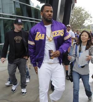 The Game builds youth basketball court in his yard