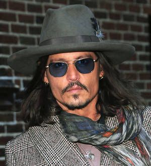 Johnny Depp surprises fans at The Lone Ranger screening