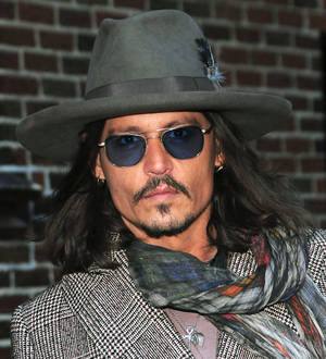 Johnny Depp surprises fans at The Lone Ranger screening