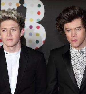 One Direction auctioning their clothes for charity