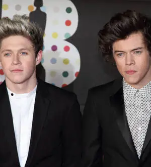 One Direction auctioning their clothes for charity