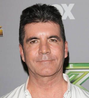 Simon Cowell defends Miami holiday with baby