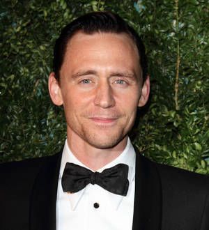 Tom Hiddleston takes carol break during Hank Williams recording session