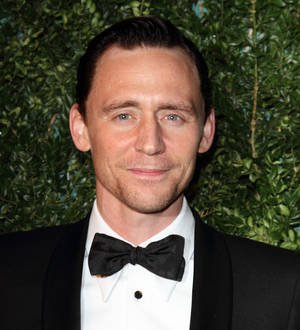 Tom Hiddleston takes carol break during Hank Williams recording session