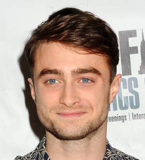 Harry Potter swaps his wand for scissors as he shows off his hairstyling skills