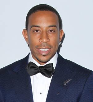 Ludacris confirms baby news in sweet beach shot