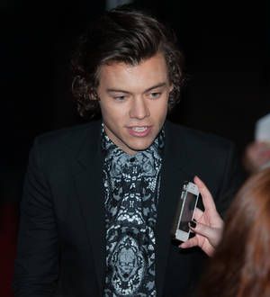Harry Styles caught short at the BRIT Awards as One Direction win big prize
