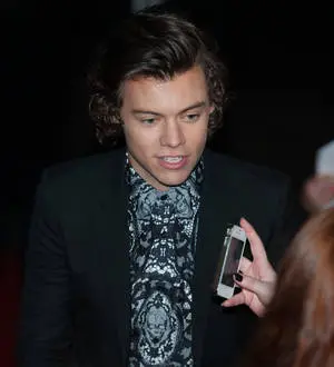 Harry Styles caught short at the BRIT Awards as One Direction win big prize