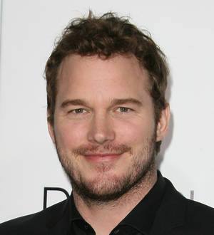Bryce Dallas Howard and Chris Pratt smile at the "Jurassic World" world premiere event