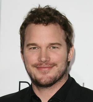 Bryce Dallas Howard and Chris Pratt smile at the "Jurassic World" world premiere event