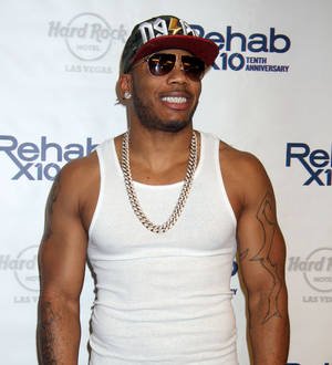Nelly beats Arsenio Hall in baseball bet