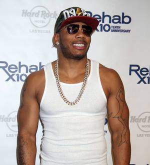 Nelly beats Arsenio Hall in baseball bet