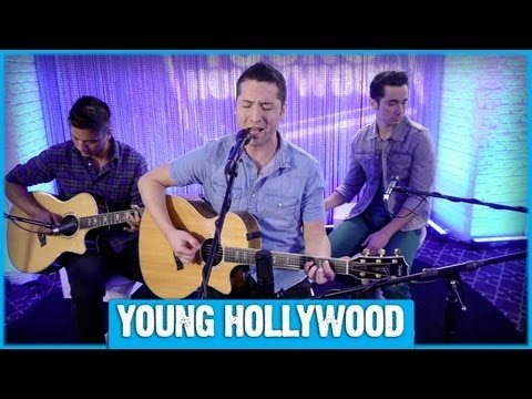Boyce Avenue members smile into the camera at a live outdoor performance venue