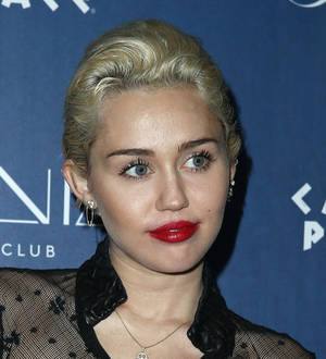 Miley Cyrus and dad Billy Ray join Steel Panther onstage
